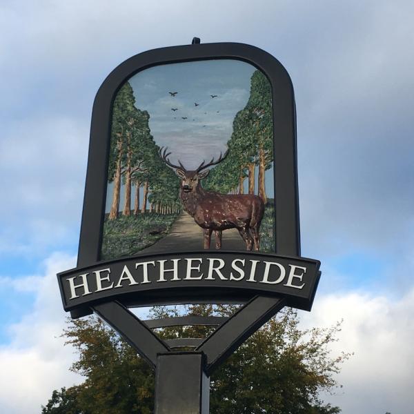 Heatherside sign with illustration of deer stag with avenue of trees