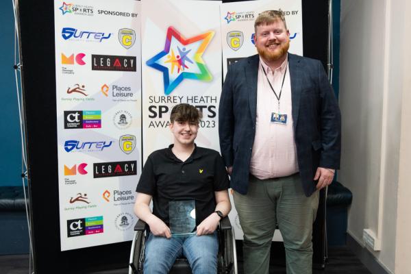 Oliver Hastings winner of Inclusive Sports Award with Surrey Heath Borough Councillor Morgan Rise