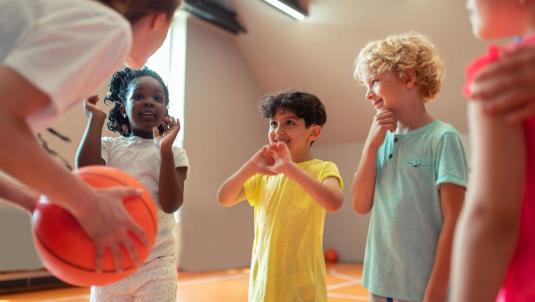 Girl coaching children sport