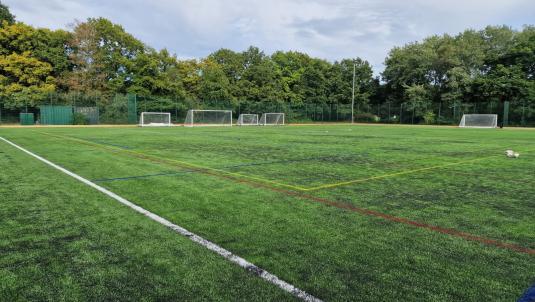 3G pitch with football goals in distance
