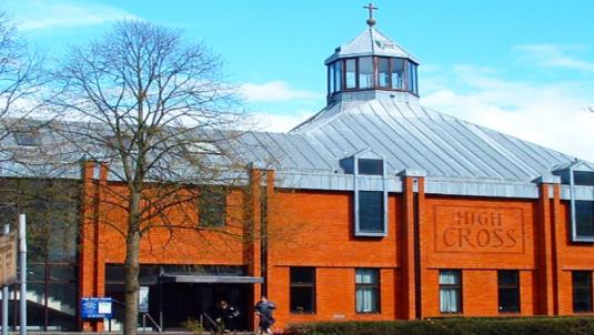 Red brick High Cross Church with lantern roof