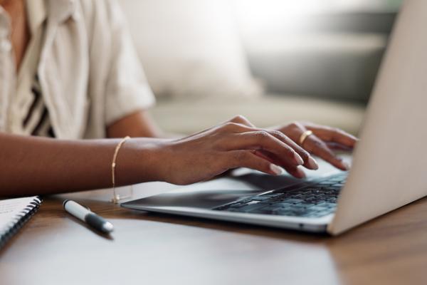 Person typing on a laptop