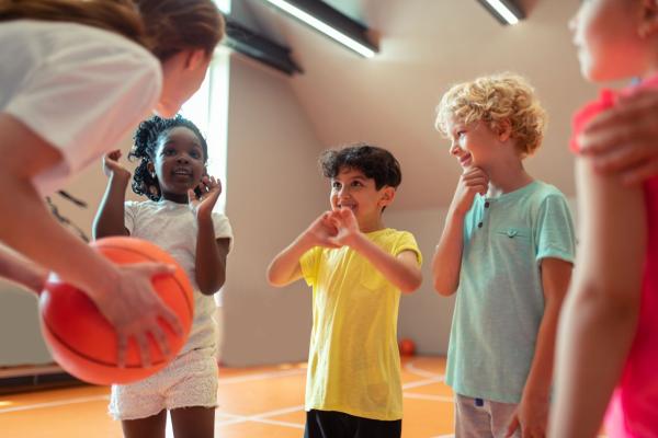 Girl coaching children sport