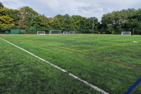 3G pitch with football goals in distance