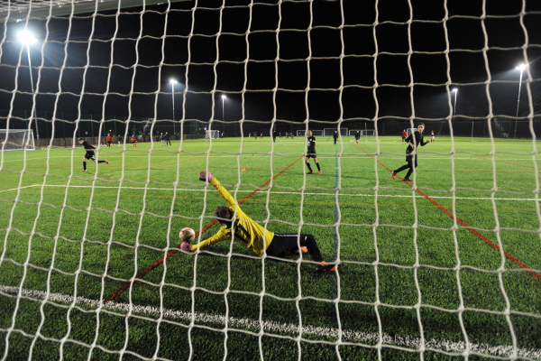 Goalkeeper saving a goal on the 3G pitch at Frimley Lodge Park
