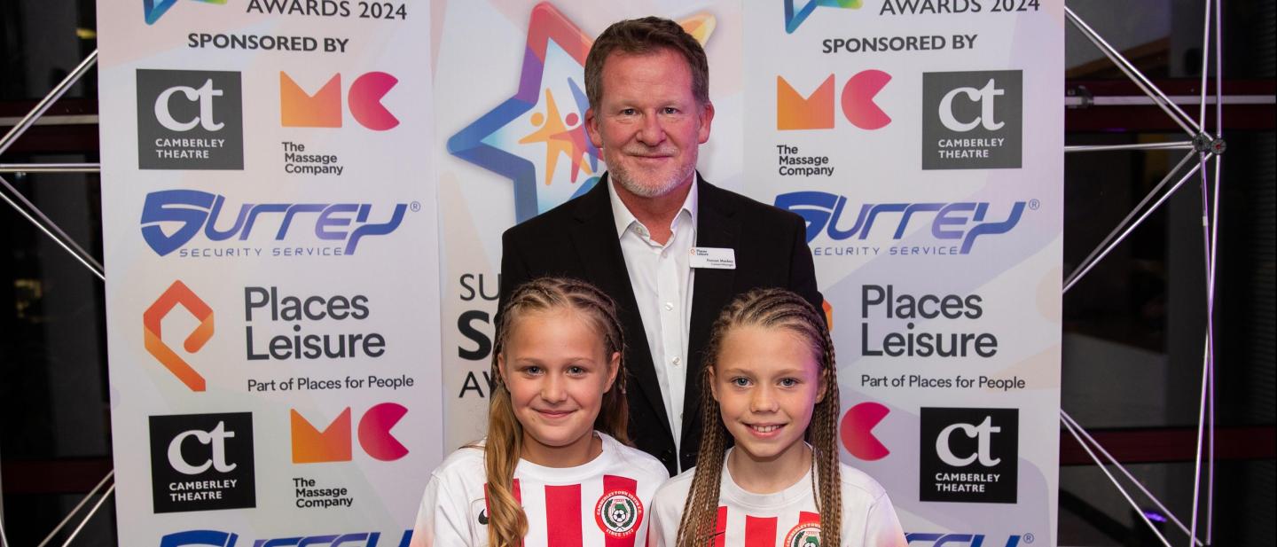 Camberley Town Football Club collecting their award on behalf of James Walpole with award sponsor, Places Leisure