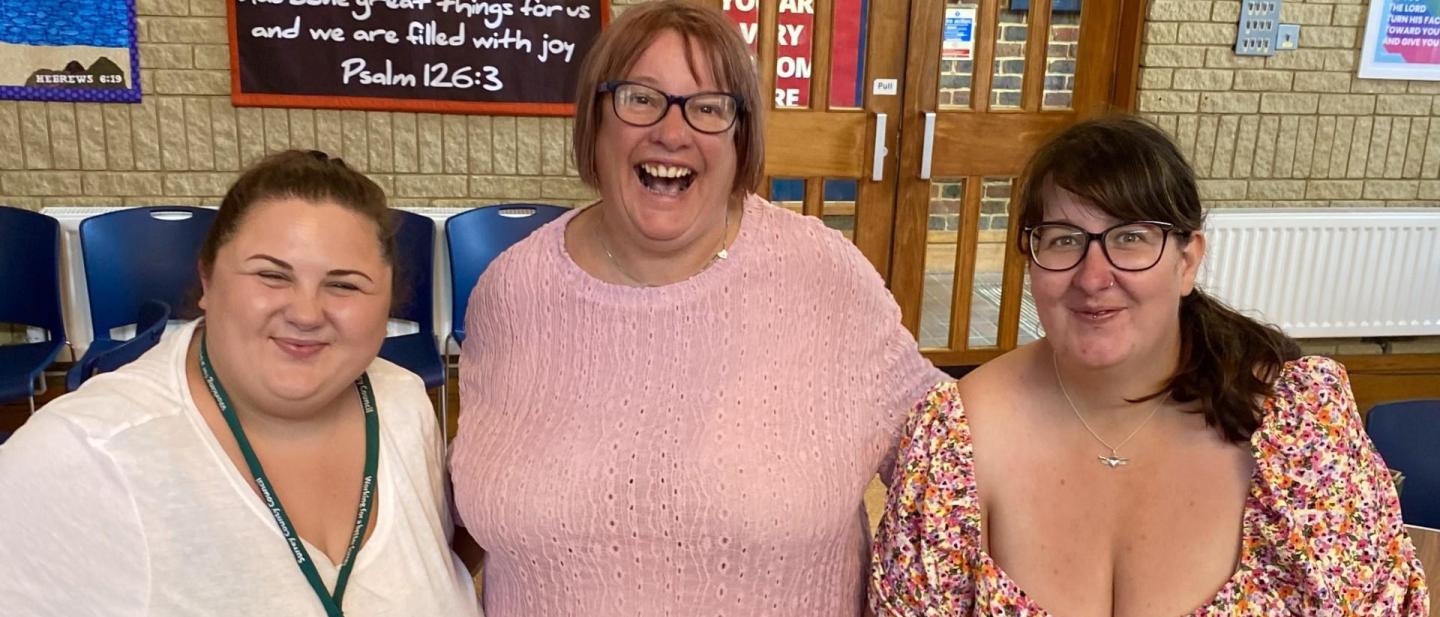 Three females looking happy at the neurodiverse children support group