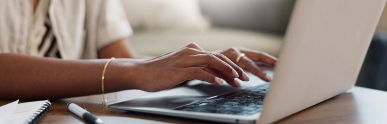Person typing on a laptop