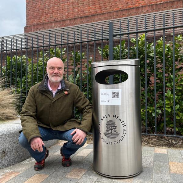 Councillor Colin Dougan next to a QR bin