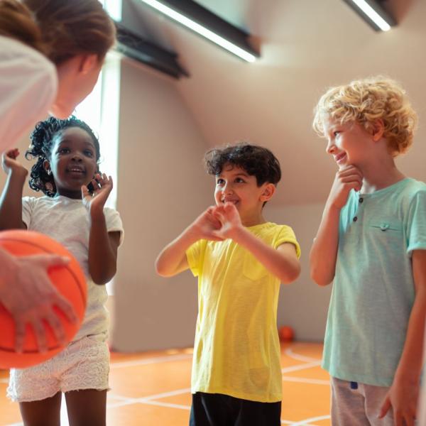 Girl coaching children sport