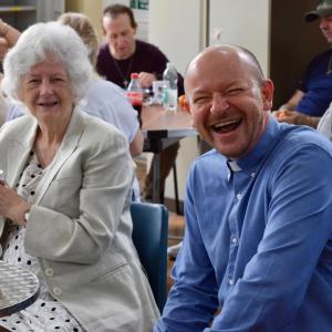 two people enjoying the community breakfast