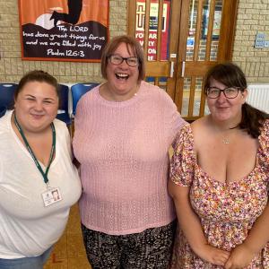 Three females looking happy at the neurodiverse children support group